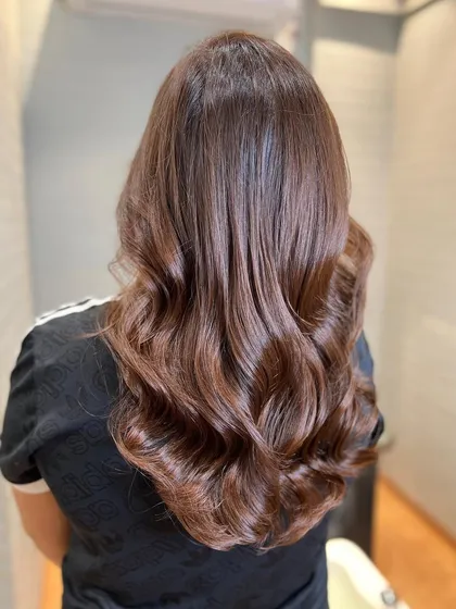 Melting into a deep mahogany brown. This color is a beautiful blend of red and brown tones, creating a sophisticated and rich look.