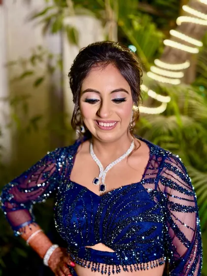 A happy, smiling bride. The makeup is designed to capture the light and make her glow.