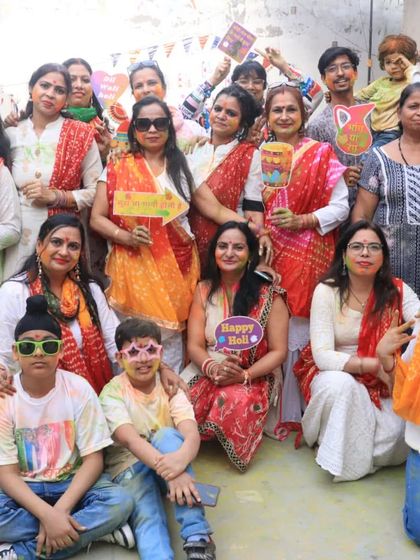 A happy group photo from our studio's Holi party. Our students and their families are the heart of our community, and we love celebrating together.