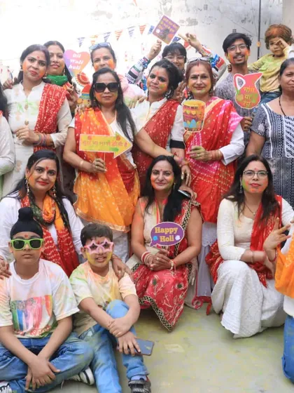 A happy group photo from our studio's Holi party. Our students and their families are the heart of our community, and we love celebrating together.