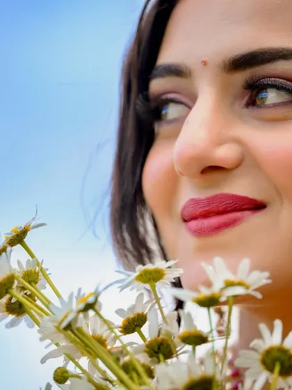 A close-up on the model's happy expression, capturing the mood of the romantic song.
