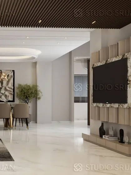 A view of the TV unit, framed by textured panels and set against a backdrop of polished marble flooring, creating a sophisticated entertainment zone.