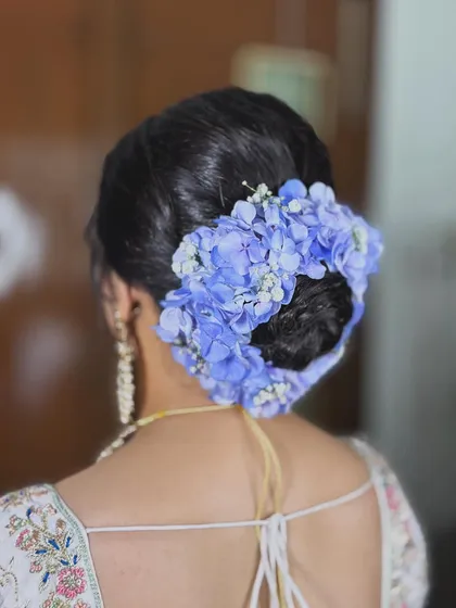 Another view of the intricate floral hairstyle. I work closely with hairstylists to create a complete and cohesive bridal look.