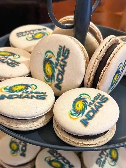 Custom branded macarons for the Mumbai Indians. This is an example of how we can incorporate branding into our culinary creations for a personalised corporate touch.