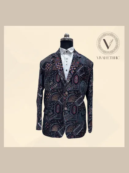 A full view of the one-of-a-kind designer blazer with intricate, multi-colored embroidery. This piece is all about a perfect fit and a trending design that will make your look stand out from the crowd.
