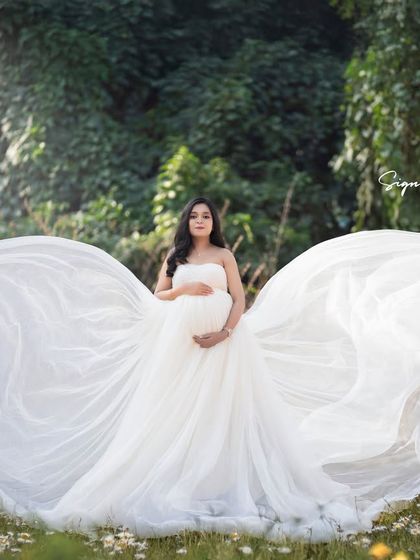 This version of the butterfly-wing gown shot showcases the beautiful contrast against the wildflower field.
