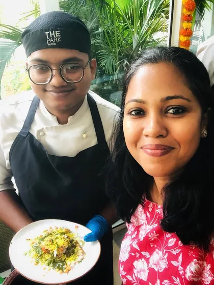 A guest chef posing with one of my team members during the Odia food festival, showcasing the collaborative spirit of these events.