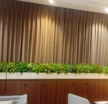 Another view of the long office planter, showing how it adds a consistent line of green across the top of the storage units.