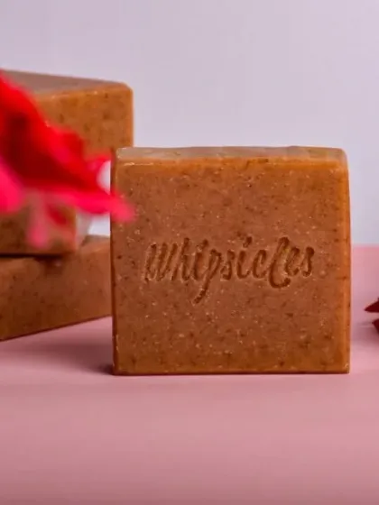 Our Floral Bliss soap, surrounded by fresh flowers. It's a gentle formula that soothes and hydrates, leaving a soft, radiant glow.