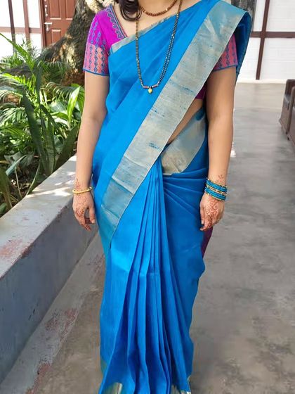 A full view of the classic South Indian drape. It's a testament to timeless elegance and is suitable for women of all ages.