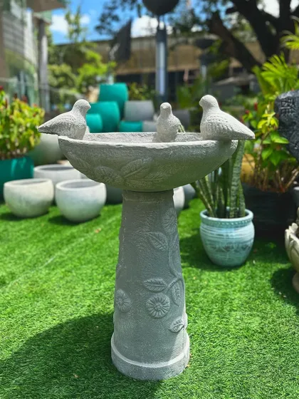 Invite nature into your garden with our pristine, hand-carved bird baths. This piece features a floral-patterned pedestal and three charming birds perched on the rim, making it both a functional and beautiful addition.