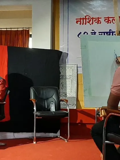 Beginning the watercolour portrait at Nashik Kala Niketan. The first washes of colour establish the basic tones and structure of the face.