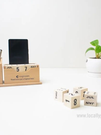 A custom wooden desk organizer is a great way to keep a workspace tidy and your brand visible. This one, made for Cognizant, includes a pen holder, phone stand, and a perpetual block calendar.