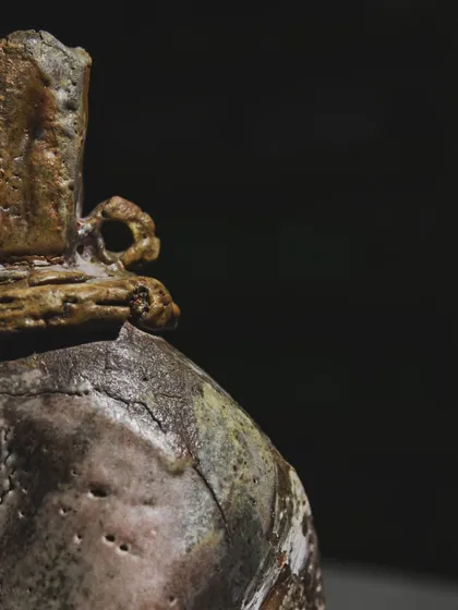 A close-up of a wood-fired sculpture, showing the rich textures and cracks that form in the intense heat. This piece was made right after a demonstration by a mentor, reminding me of how sharing knowledge fuels growth.