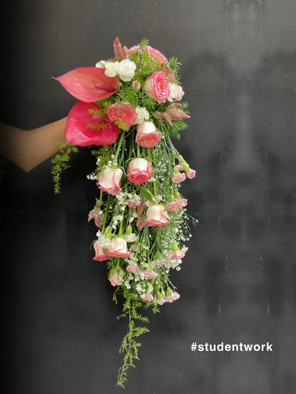 This stunning cascading bridal bouquet was created by one of our students. We guide you through professional techniques to craft breathtaking arrangements, turning your passion for flowers into true floral artistry for weddings and special events.
