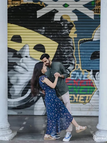 For the modern couple that loves a bit of edge, an urban pre-wedding shoot offers a vibrant backdrop. Here, we used the striking graffiti walls in Delhi to create a dynamic and playful dance shot that reflects their personalities.