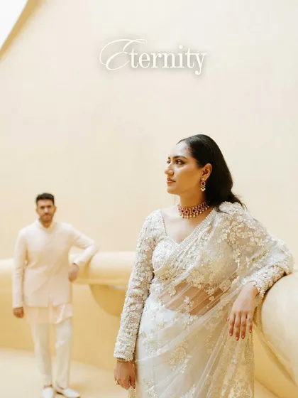 An artistic portrait with the word "Eternity" overlaid. The composition, with him in the background and her looking towards the future, creates a thoughtful and story-driven image.