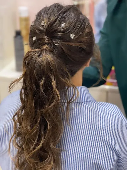 A back view of the ponytail, showing the intricate twist at the base.