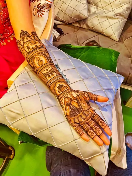 A different angle of the bride and groom figure design, showing how it integrates with the full arm patterns.