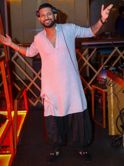 A full-length shot in a stylish ethnic outfit. Use your smile to change the world.