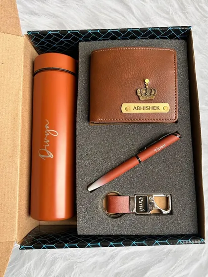 This is my popular Black Box Combo, shown here in a stylish tan color. The set includes a personalized 700ml turbo bottle, a Nexon men's wallet, a matching pen, and a hook keychain, all neatly presented in a custom-fit gift box.
