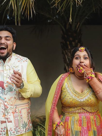 A candid and funny moment from a Haldi party. The couple's shocked and amused expressions are priceless.