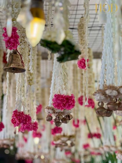 A soft-focus shot of the hanging floral and bell tassels, creating a dreamy and artistic image that captures the magic of the decor.