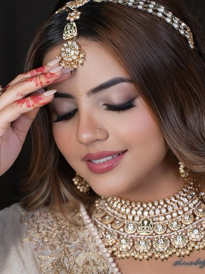 An eyes-closed, serene shot that focuses on the beauty of the jewellery and the model's peaceful expression.