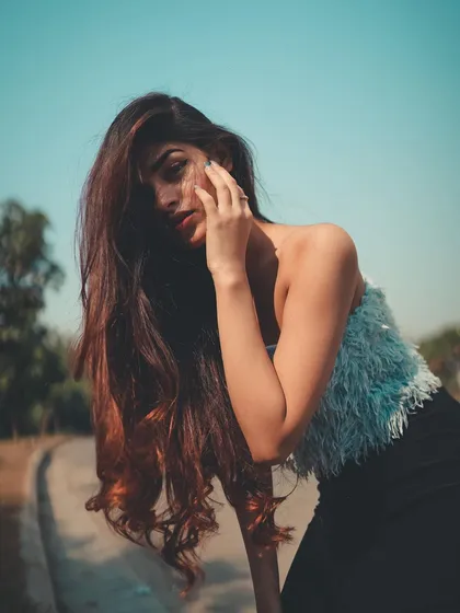 A softer, more intimate portrait from the same series. The way she frames her face with her hand draws you into her expression.