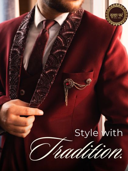 Style with tradition. A close-up of a maroon suit with an embellished lapel, a classic look for any formal event.