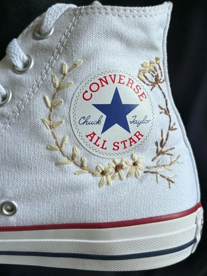 A close-up of the custom embroidery around the Converse logo.