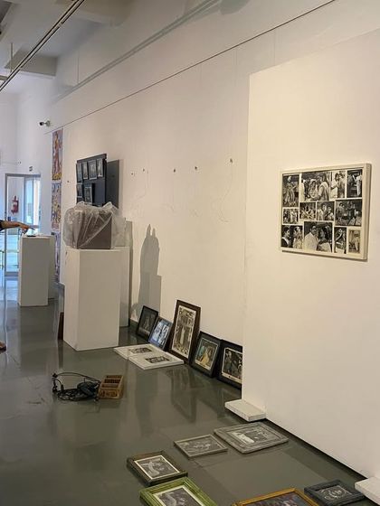 The artist and curator discussing the layout in the early stages of installation.