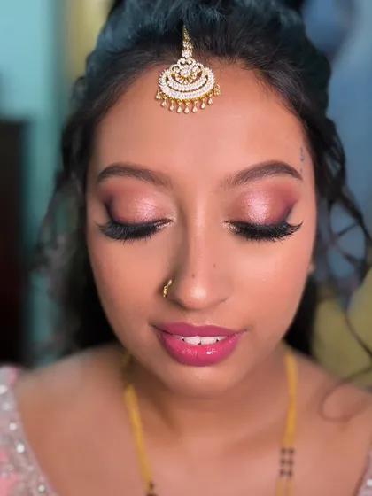 My bride Nasreen looking like a doll for her reception in Krishnagiri. We did a glamorous pink smokey eye with dramatic lashes.