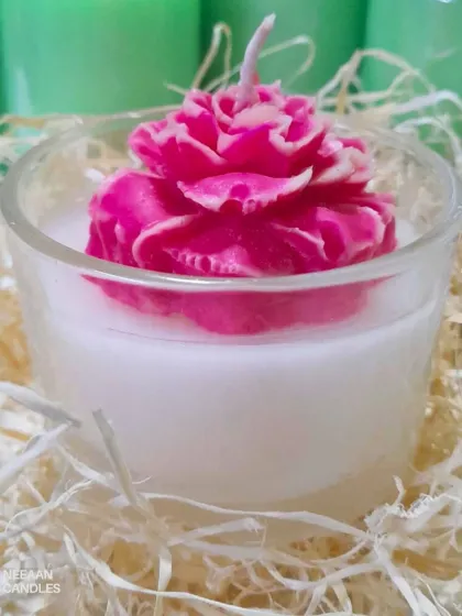 This handcrafted floral candle is a whole vibe. A delicate pink rose is set inside a premium glass jar, perfect for adding a touch of elegance to your space.