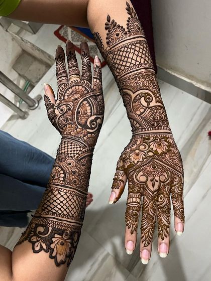 This is the same design as the previous image, showing a slightly different angle. It highlights the peacock motif and the intricate details on the fingers.
