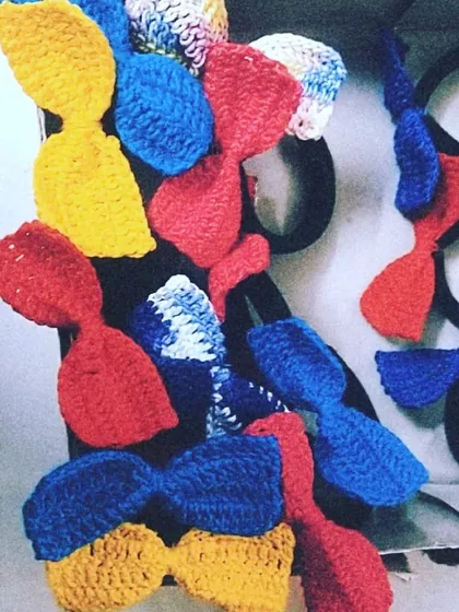 These colorful crochet bow hair ties are perfect for adding a playful touch to ponytails or braids. We make them in a variety of solid and two-tone color combinations.
