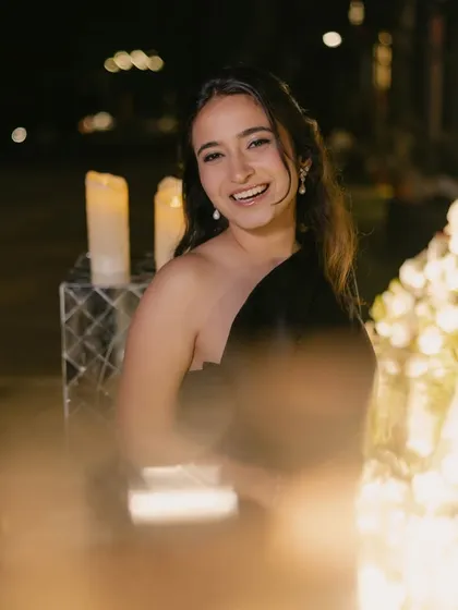 A joyful moment captured at her cocktail party. The soft glam makeup looks beautiful and natural, even in the warm glow of the party lights.