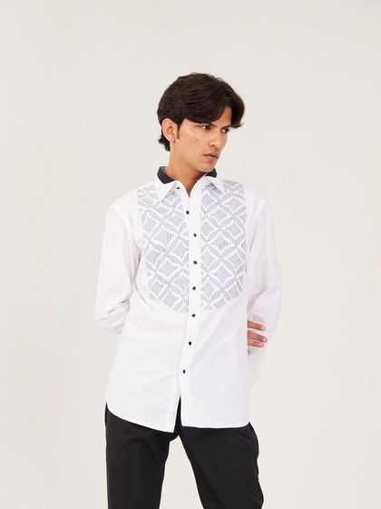 A medium shot of the white textured shirt, showing its clean lines and sophisticated design. It's an ideal choice for formal events or a high-fashion statement.