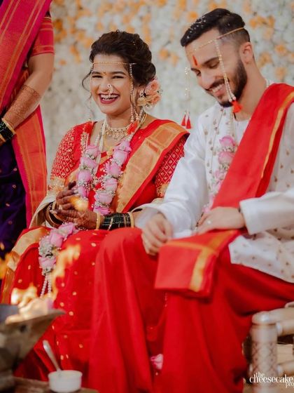 Happy brides are the prettiest. This candid shot from a wedding ceremony shows the bride's genuine happiness, enhanced by a flawless makeup look.