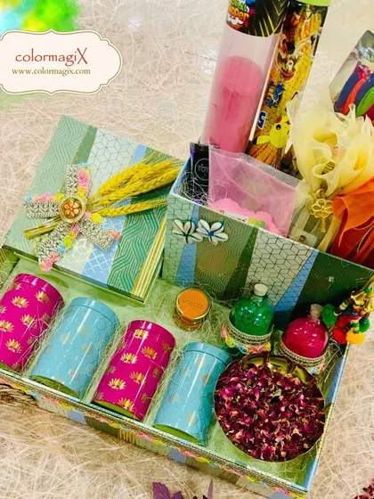 This elegant Holi hamper features a beautiful floral design. Inside, it contains colorful jars of treats, gulal, and other festive essentials, all curated with our signature touch of luxury.