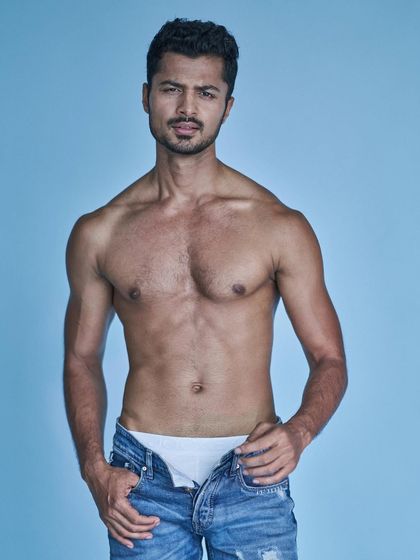 Stand firm, act with conviction, be strong. This pose captures a sense of strength and confidence for a fashion shoot.