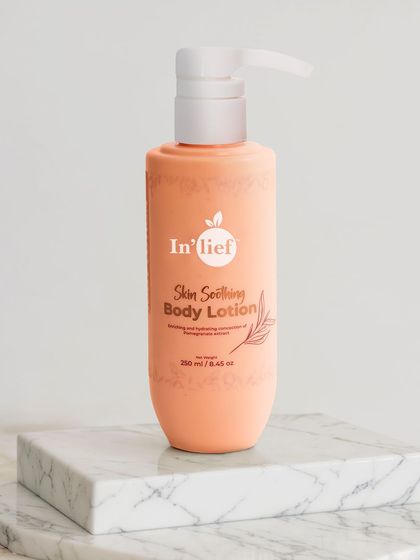 In'lief body lotion presented on a marble block. Using materials like marble adds a touch of luxury and sophistication to the product's image.