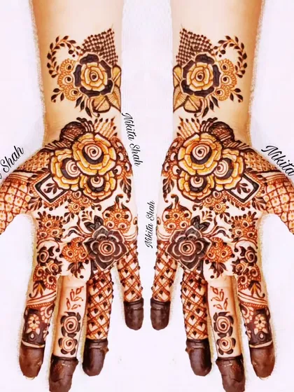 I love blending styles, and this Indo-Western design is a great example. It combines bold rose florals with delicate traditional patterns for a look that is modern, elegant, and perfect for any party or sangeet.