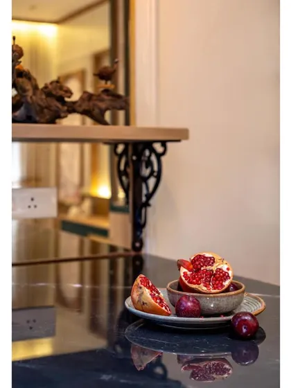 A beautifully styled shot of fresh fruit on the dining table, emphasizing the space as a hub for family life and healthy living.