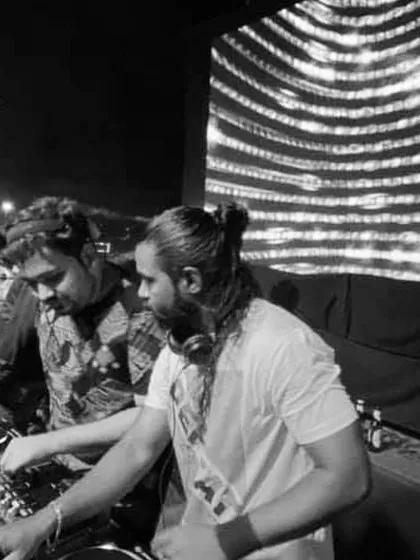 A black and white shot from a back-to-back set with DJ Mons. The focus is always on the music and creating a seamless mix for the crowd.