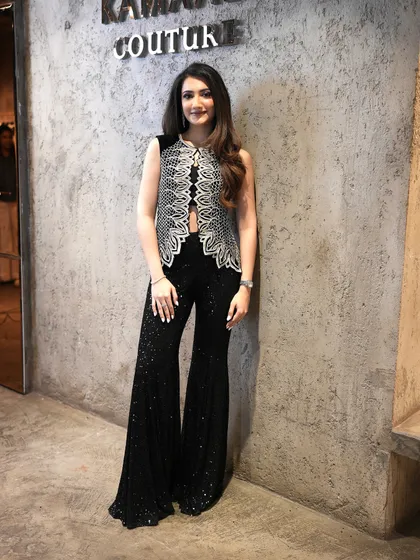 A client looking stunning in my embellished waistcoat and dazzling sequin pants, capturing the essence of festive glam.