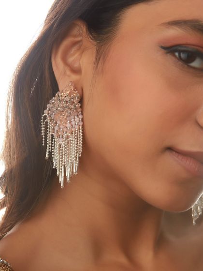 A close-up of our silver tassel earrings, a bestseller that remains a strong favorite for its modern appeal.