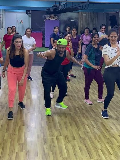 A dynamic shot of our members learning a new Zumba combination. Our classes are a judgment-free zone where you can learn at your own pace.
