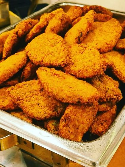 A close-up of our Bhetki fish fry, a testament to our expertise in Bengali cuisine. The golden-brown crust is achieved by frying to perfection, making it an irresistible appetizer.
