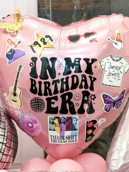 The details are what make a piece special. This close-up of the custom "In My Birthday Era" balloon shows the level of personalization I can achieve, incorporating specific tour-related stickers and motifs to delight any Swiftie.